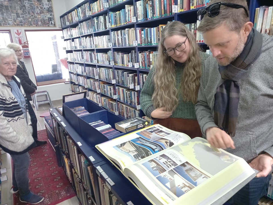 Customers browsing books at Our Book Exchange